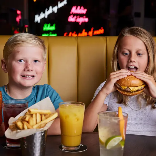 Children eating burgers at SOUND London