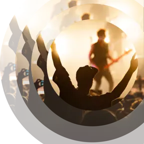 Someone dancing in front of a stage